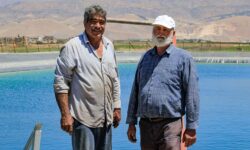 Wastewater treatment plants and farmers in Bekaa village, Lebanon. Farmers stand next to an artificial lake made for agricultural use. Photo: Lien Arits/IWMI