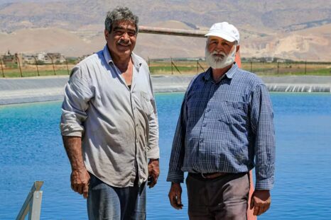 Wastewater treatment plants and farmers in Bekaa village, Lebanon. Farmers stand next to an artificial lake made for agricultural use. Photo: Lien Arits/IWMI